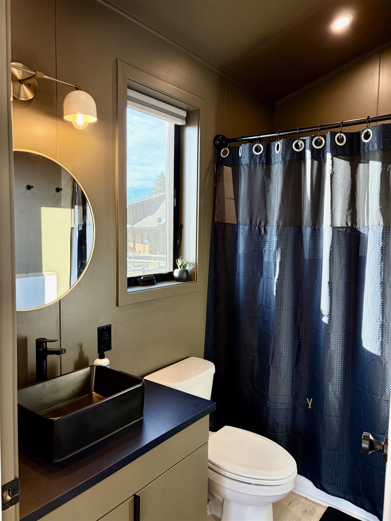 Bathroom shower and vanity at Glacier Mountain Getaway
