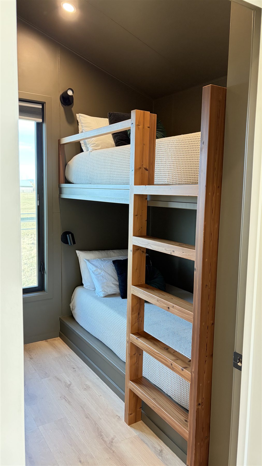 Wooden bunk room at Glacier Mountain Getaway near Bozeman
