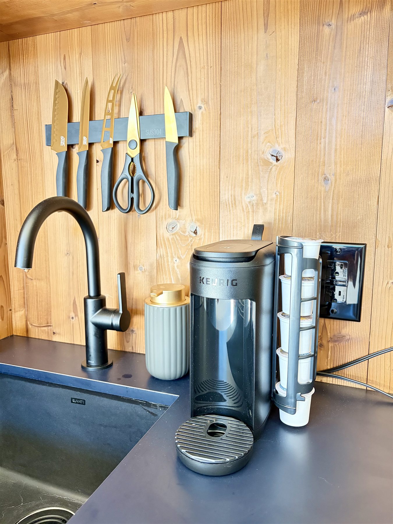 Coffee maker and sink at Glacier Mountain Getaway