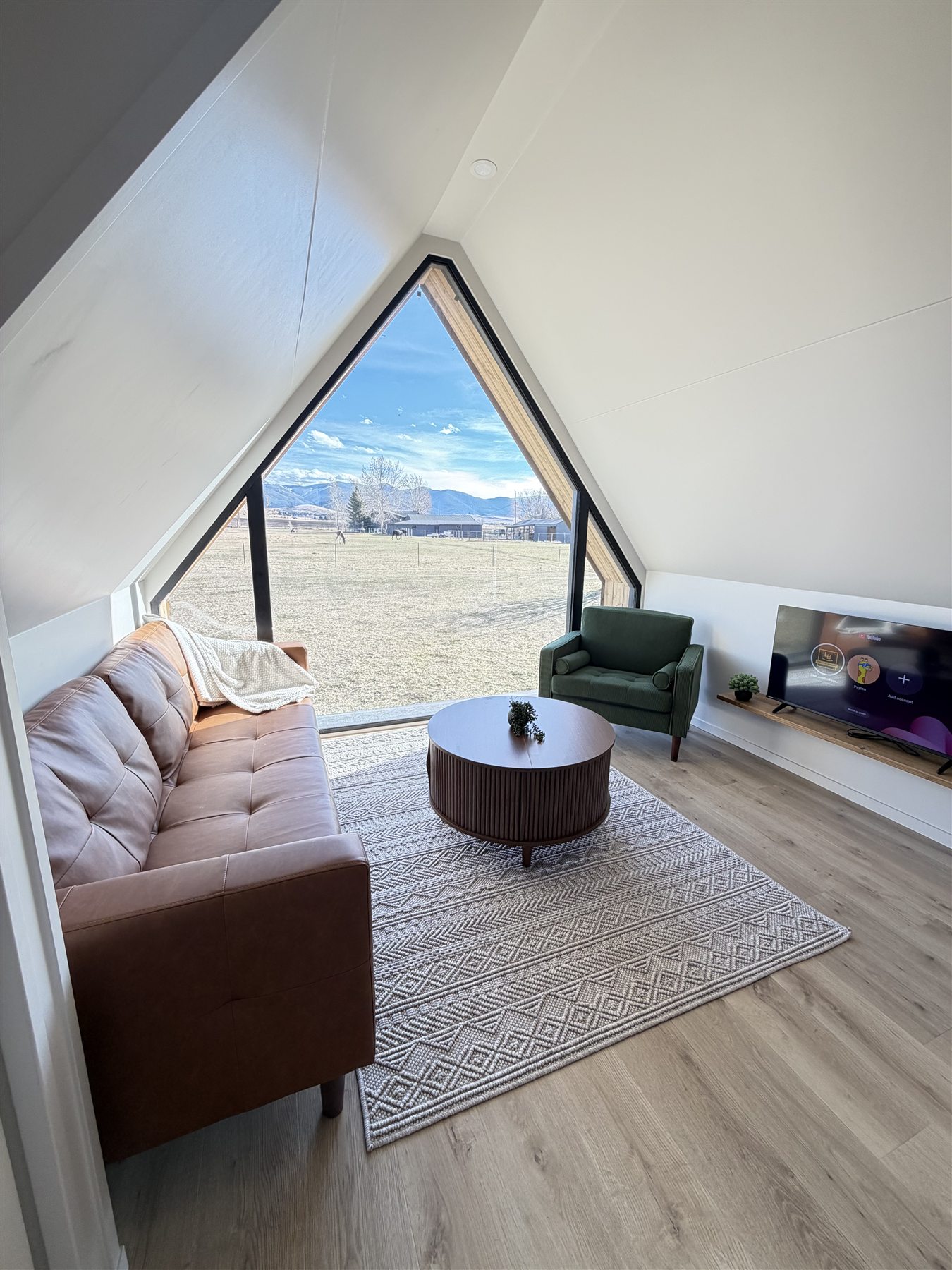 Glacier Mountain Getaway living room with A-frame window near Bozeman Montana