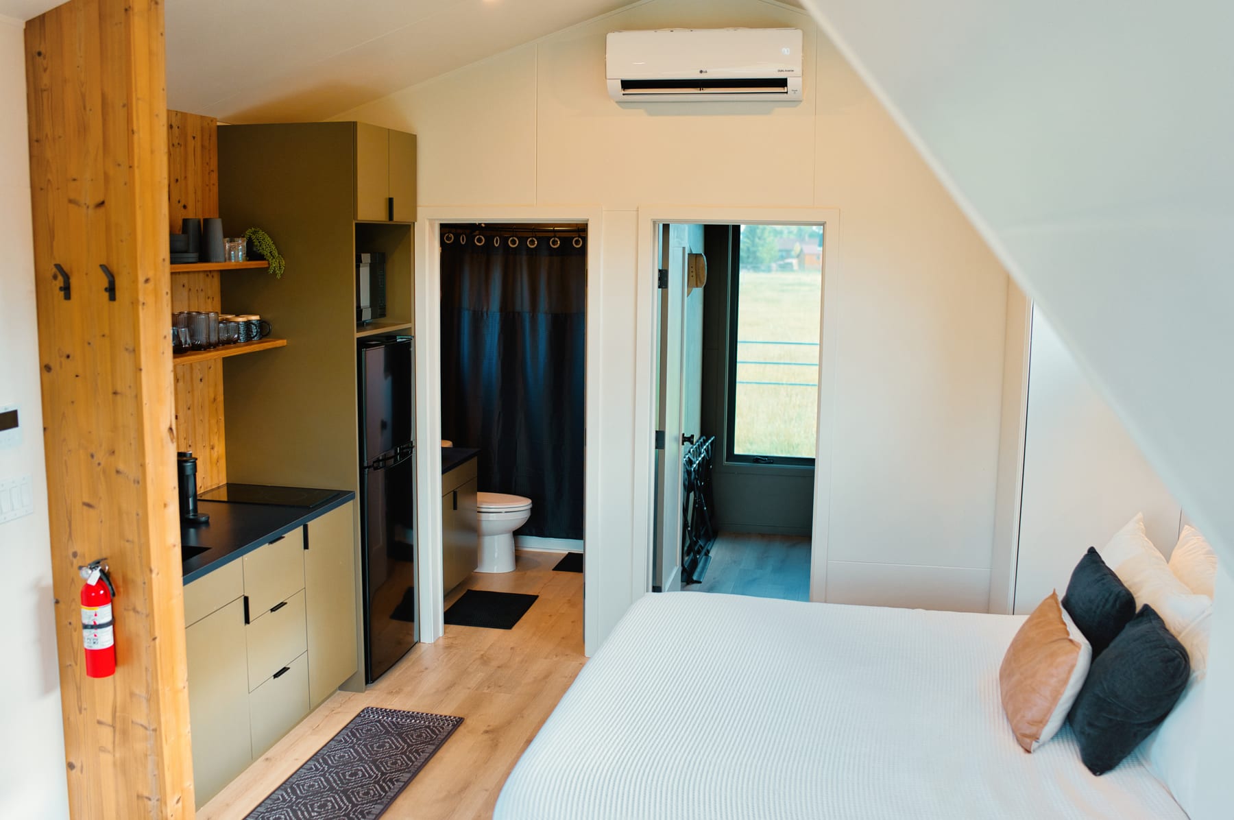Open layout between bed and kitchenette at Glacier Mountain Getaway near Bozeman Montana