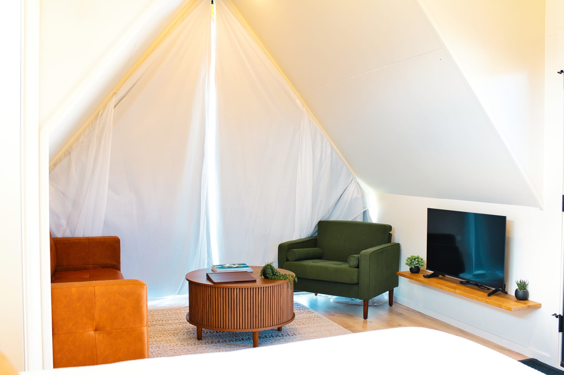 Living room with draped window at Glacier Mountain Getaway near Bozeman Montana
