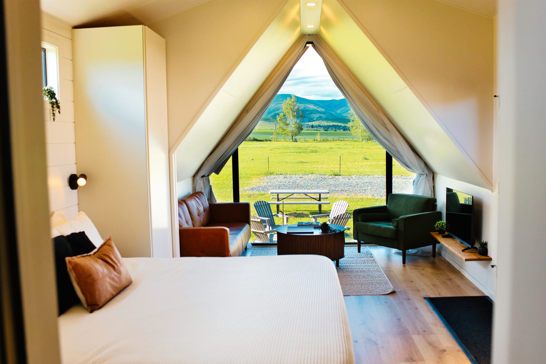 Main living area with large window at Glacier Mountain Getaway near Bozeman Montana