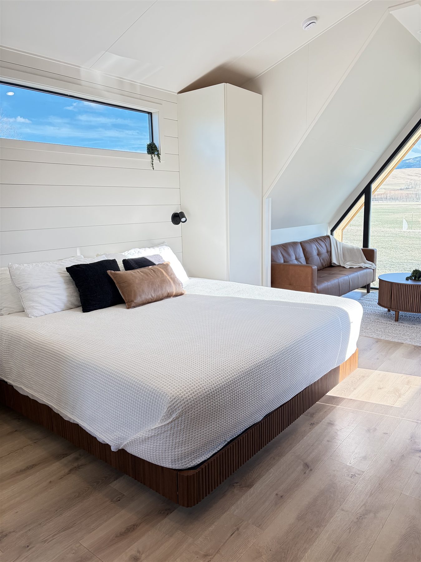 Primary bedroom inside Glacier Mountain Getaway A-frame cabin
